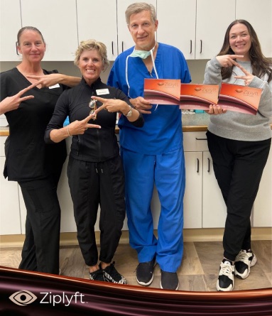 Dr. Kent and team holding Ziplyft kits