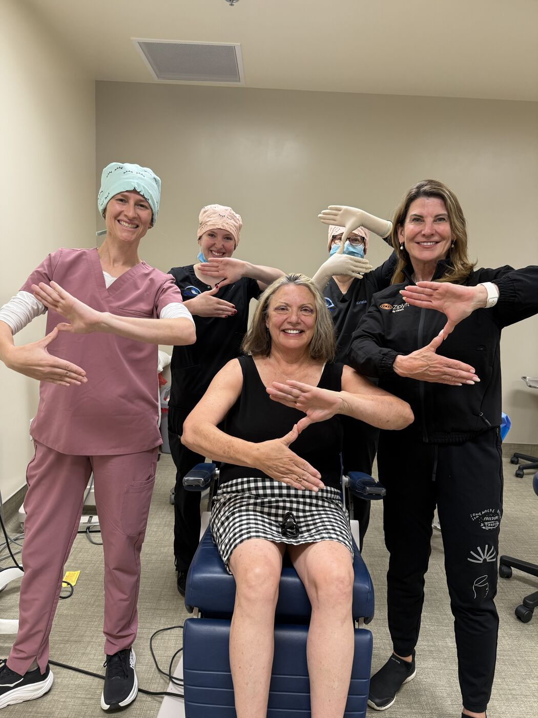 Dr. Stephanie Hoatson and her clinical team with a patient after a Ziplyft treatment at Bend Ophthalmology